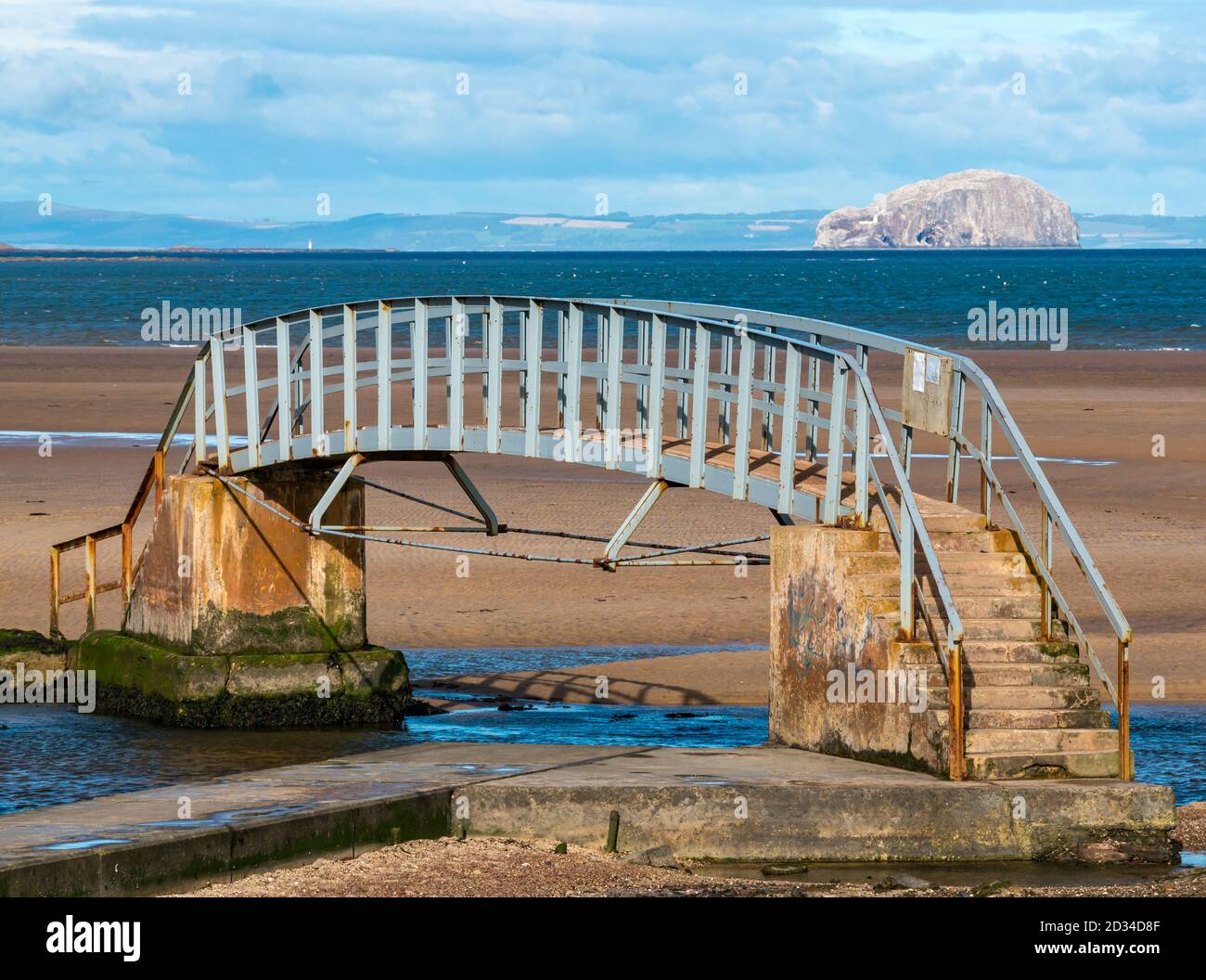 Belhaven, East Lothian, Scotland, United Kingdom, 7th October 2020. UK Weather: sunshine on the Bridge to Nowhere. The bridge over the Biel Water is only accessible at low tide for visitors to the beach at Belhaven Bay with a view of the Bass Rock island gannet colony on the horizon Stock Photo