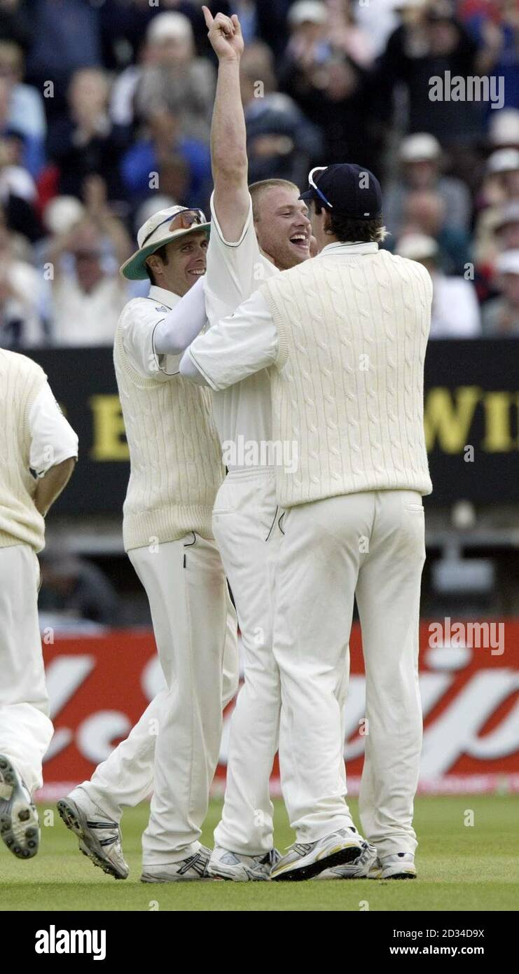 England's Andrew Flintoff celebrates trapping Australia batsman Mike Kasprowicz LBW with Michael Vaughan (L) and Kevin Pietersen. Stock Photo