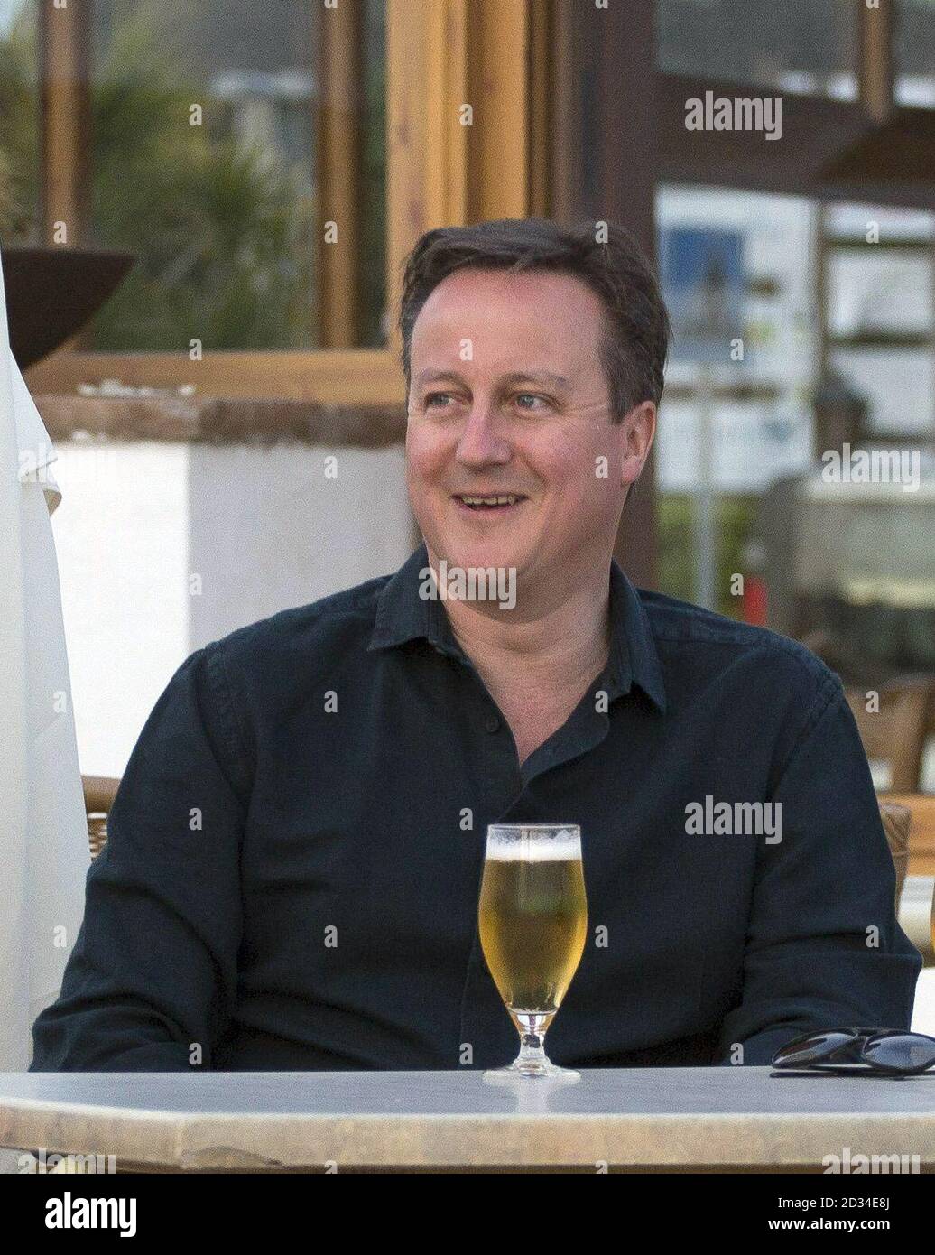 Prime Minister David Cameron pose for a photograph during his holiday with his wife Samantha in Playa Blanca, Lanzarote. Stock Photo