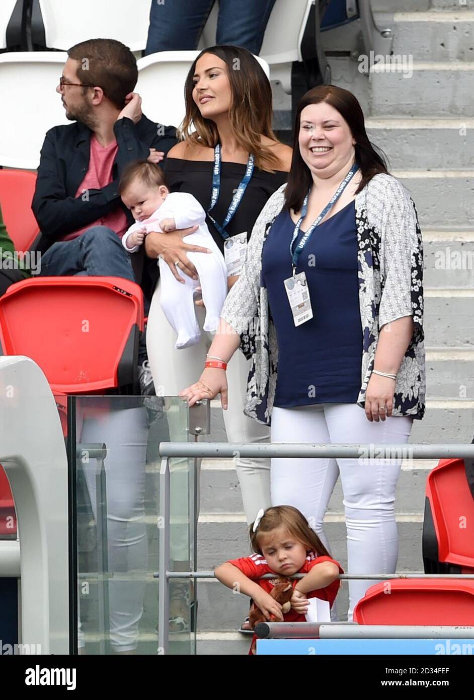 Wales' Gareth Bales partner Emma Rhys-Jones (centre left) , holding  daughter Nava Valentina, sister Vicky Bale (right) with daughter Alba Violet  (bottom) during the round of 16 match at the Parc de