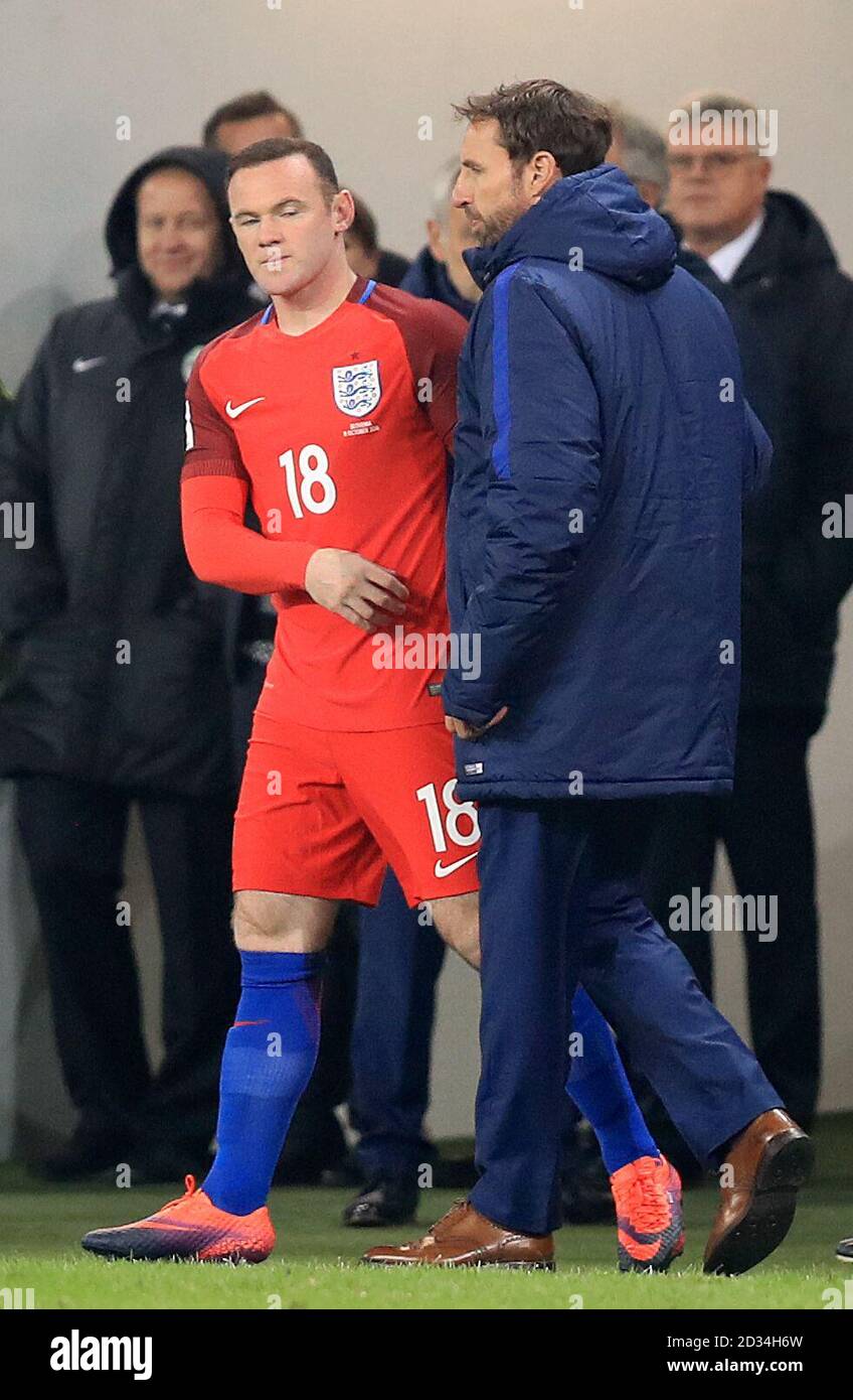 England's Wayne Rooney (left) is brought on as a substitute by interim manager Gareth Southgate (right) during the 2018 FIFA World Cup Qualifying match at the Stozice Stadium, Ljubljana. Stock Photo