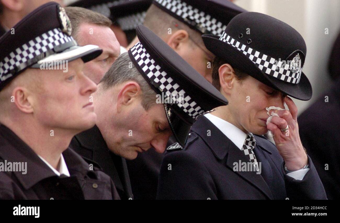 Colleagues of a policeman Alan McMurray during his funeral at Warriston Crematorium, Edinburgh. Stock Photo