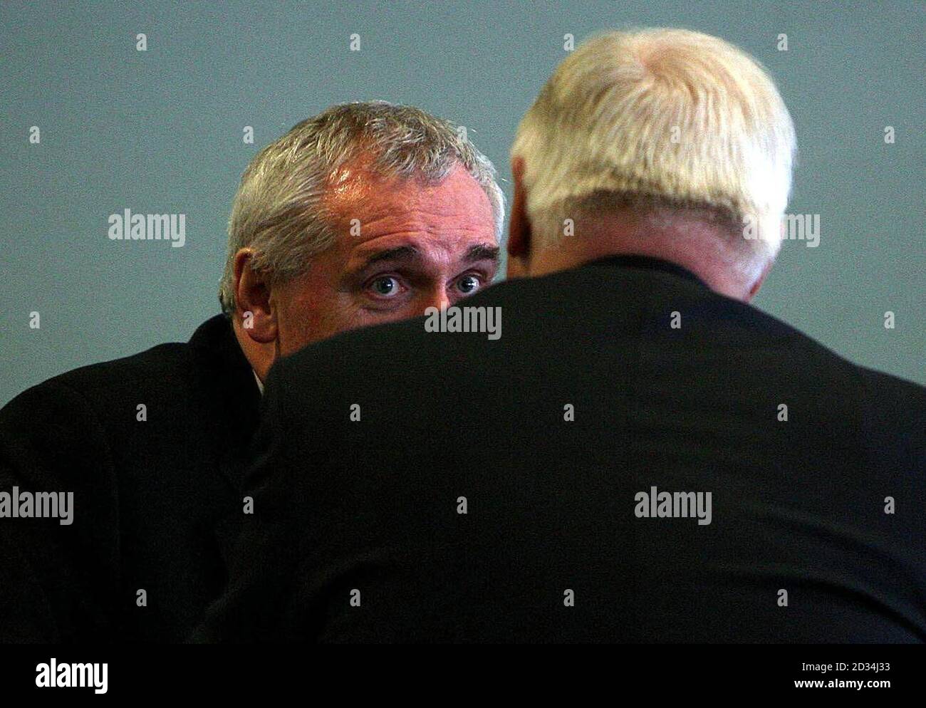 Taoiseach Bertie Ahern (left) has a quiet word with Lord Chris Patten at the Irish Bishops' Commission for Justice and Social Affairs conference called 'Common Good in an Unequal World' at Croke Park in Dublin, Thursday March 2, 2006. See PA story RELIGION Conference Ireland. PRESS ASSOCIATION Photo. Photo credit should read: Julien Behal/PA Stock Photo