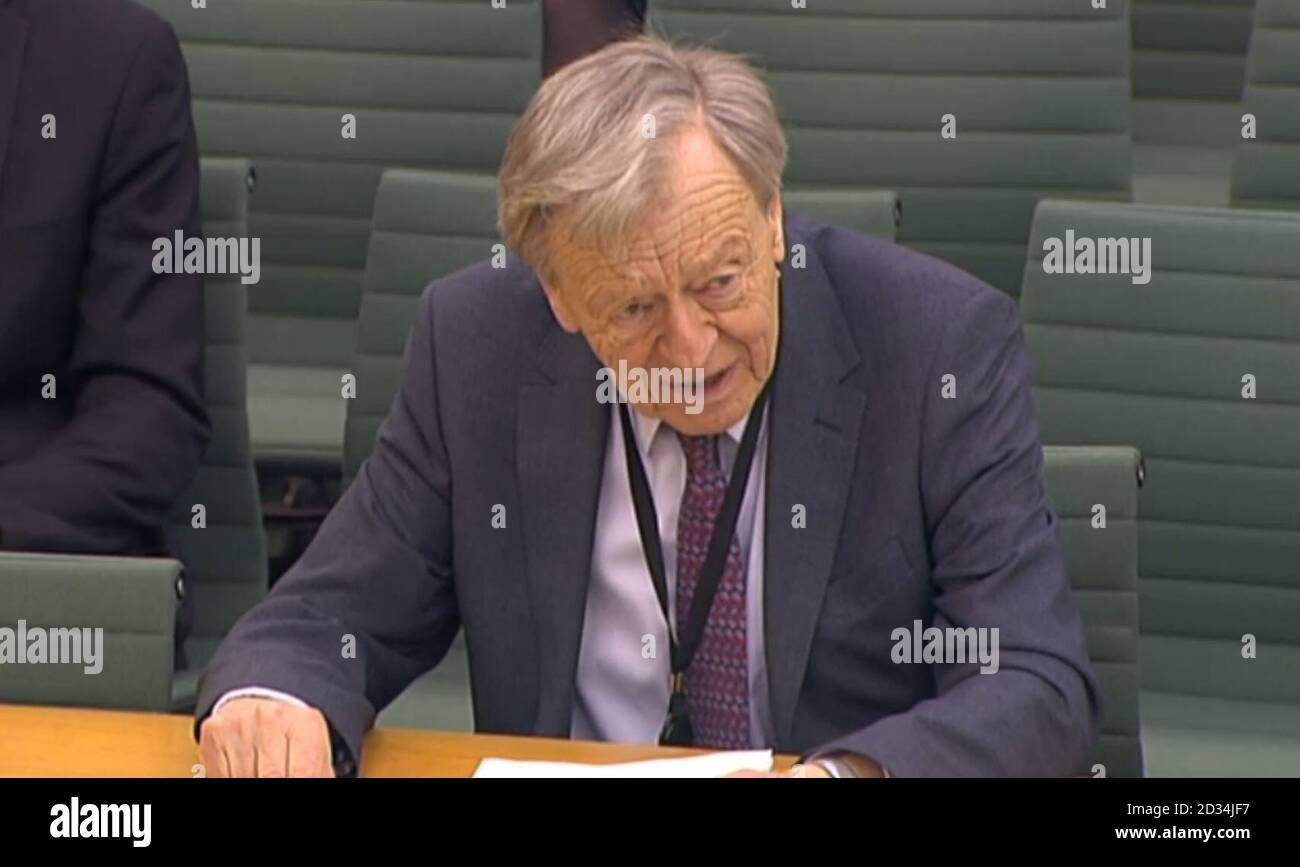 Labour peer Lord Dubs answering questions in front of the International Development Select Committee at the House of Commons, London on the subject of the Syrian Refugee crisis. Stock Photo