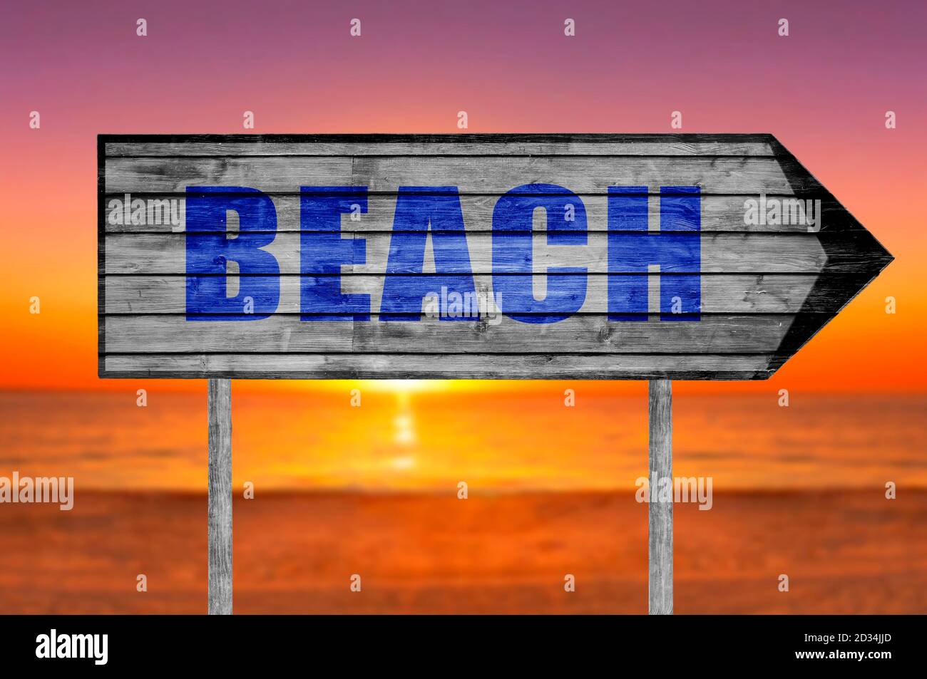 Beach wooden sign with a beach on background Stock Photo - Alamy