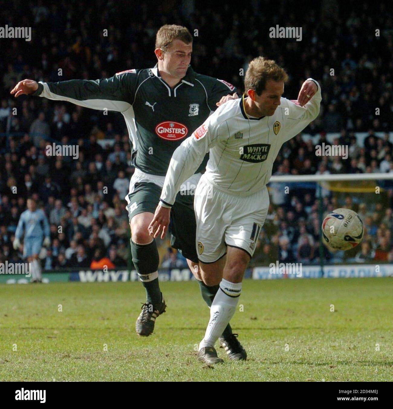 Leeds' Eddie Lewis (R) battles with Plymouth's Paul Wotton during the Coca-Cola Championship match at Elland Road, Leeds, Saturday April 8, 2006. Stock Photo
