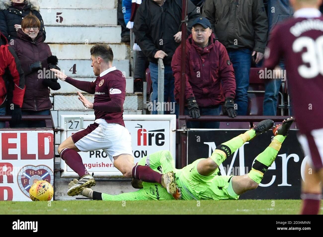 Hearts Ross Callachan is brought down in the box by Celtic goalkeeper Craig Gordon, resulting in a penalty, during the Ladbrokes Scottish Premiership match at Tynecastle Stadium, Edinburgh. Stock Photo