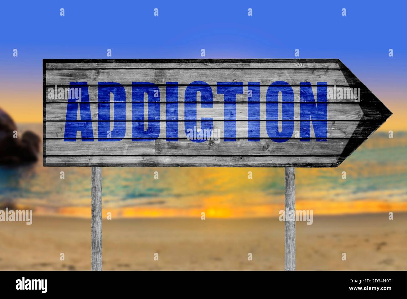 Addiction wooden sign with a beach on background Stock Photo - Alamy