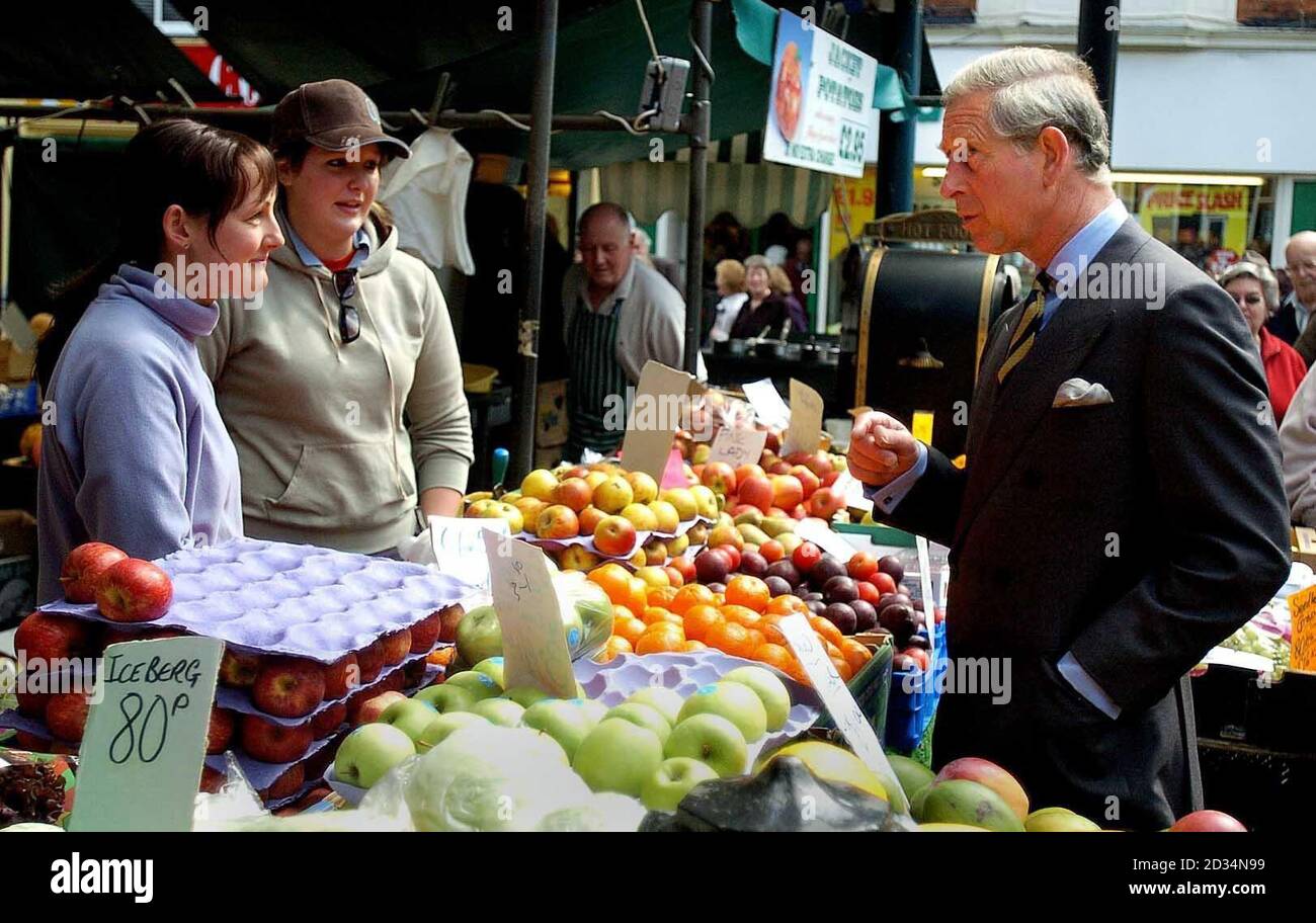 The Prince of Wales talks to market stall holders during a visit to Lincoln. He is visiting the area as president of The Prince's Foundation for the Built Environment, the charity responsible for the redevelopment masterplan which aims to turn Lincoln into a modern, sustainable city. Stock Photo