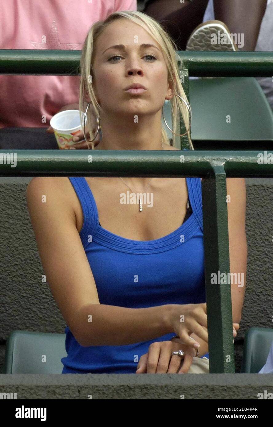 Australia's Lleyton Hewitt's wife Bec Cartwright watches during the second round of The All England Lawn Tennis Championships at Wimbledon. Stock Photo