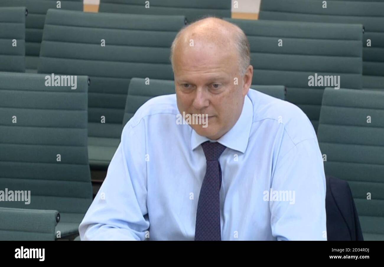 Transport Secretary Chris Grayling answers questions in front of the Transport Select Committee at the House of Commons, London, on the Intercity East Coast rail franchise. Stock Photo