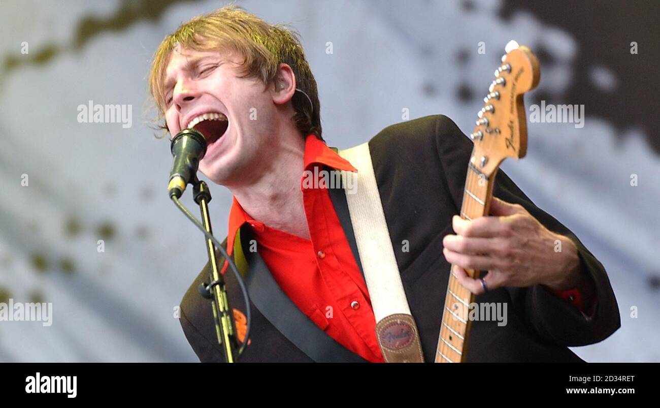 Franz Ferdinand lead singer Alex Kapranos performs on the Main Stage at the T in the Park music festival in Balado, Scotland. Stock Photo