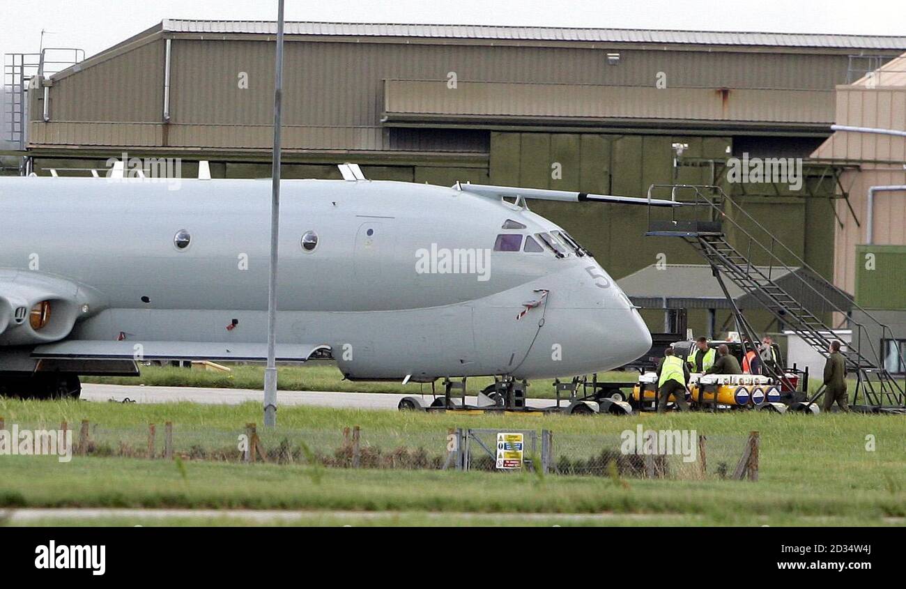 A Nimrod on the tarmac at RAF Kinloss. Flowers were left outside the station in tribute to the 14 British service personnel who died when their reconnaissance plane crashed in Afghanistan. Stock Photo