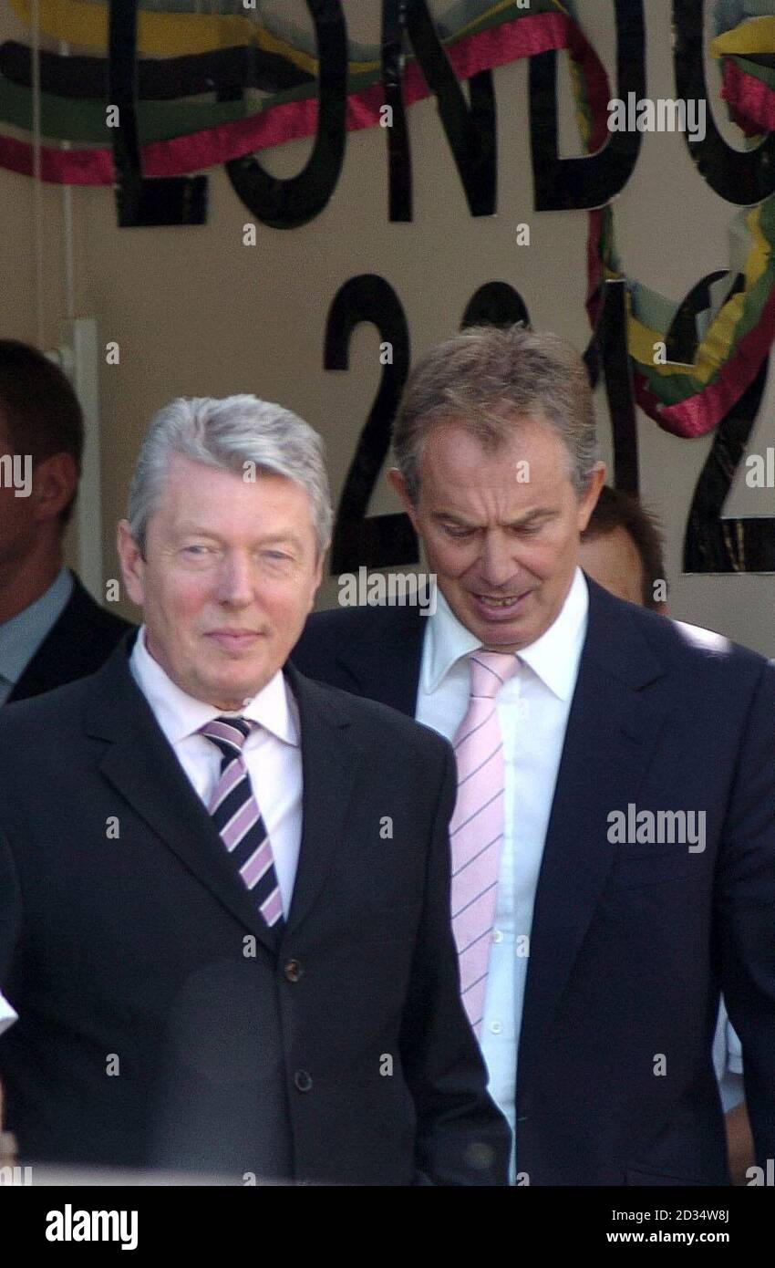 Britain's Prime Minister Tony Blair (right) leaves the Seven Mills School in Tower Hamlets, east London, with Education Secretary Alan Johnson, following a visit. Stock Photo