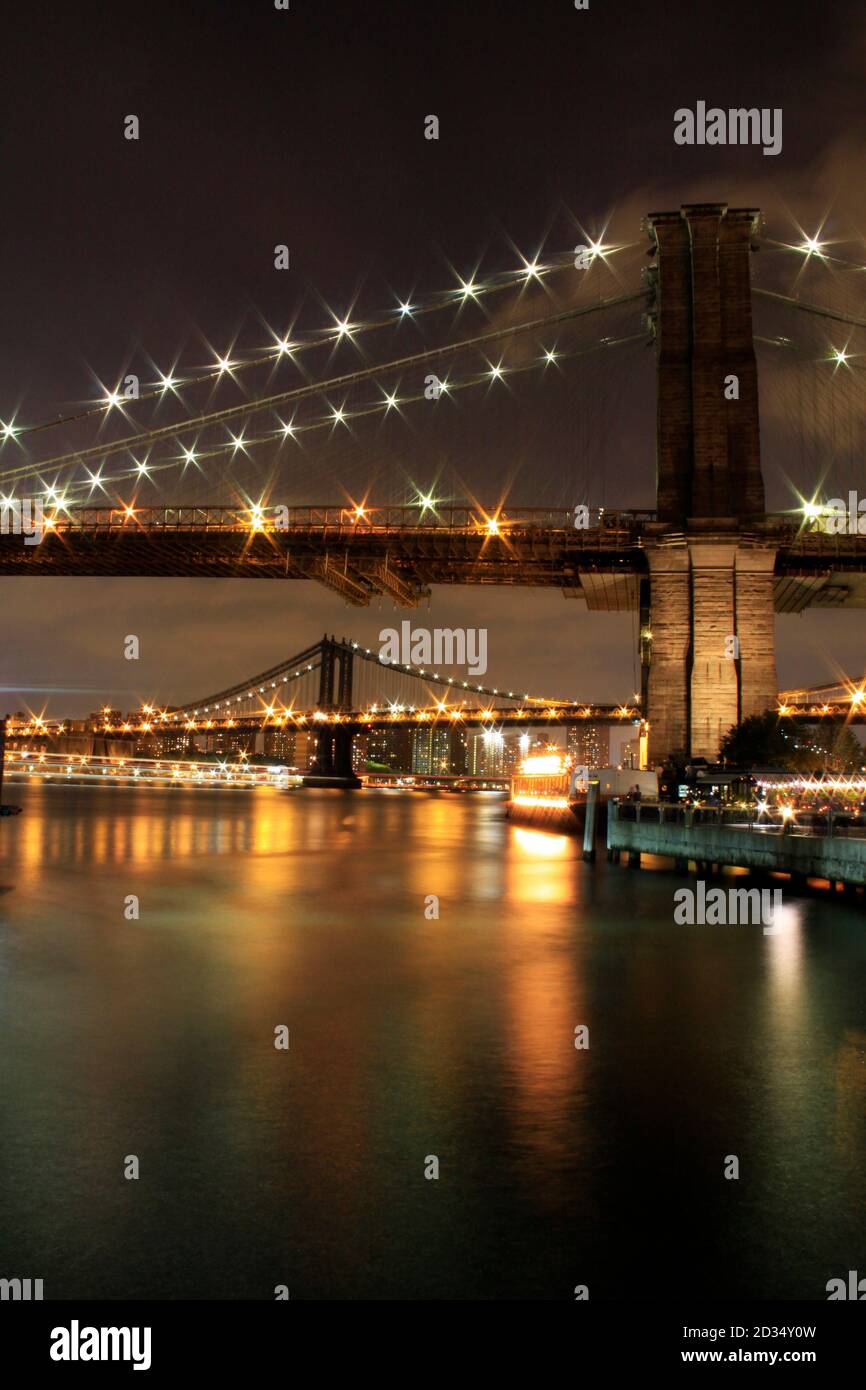 Brooklyn Bridge at night and Times Square IN NYC Stock Photo Alamy