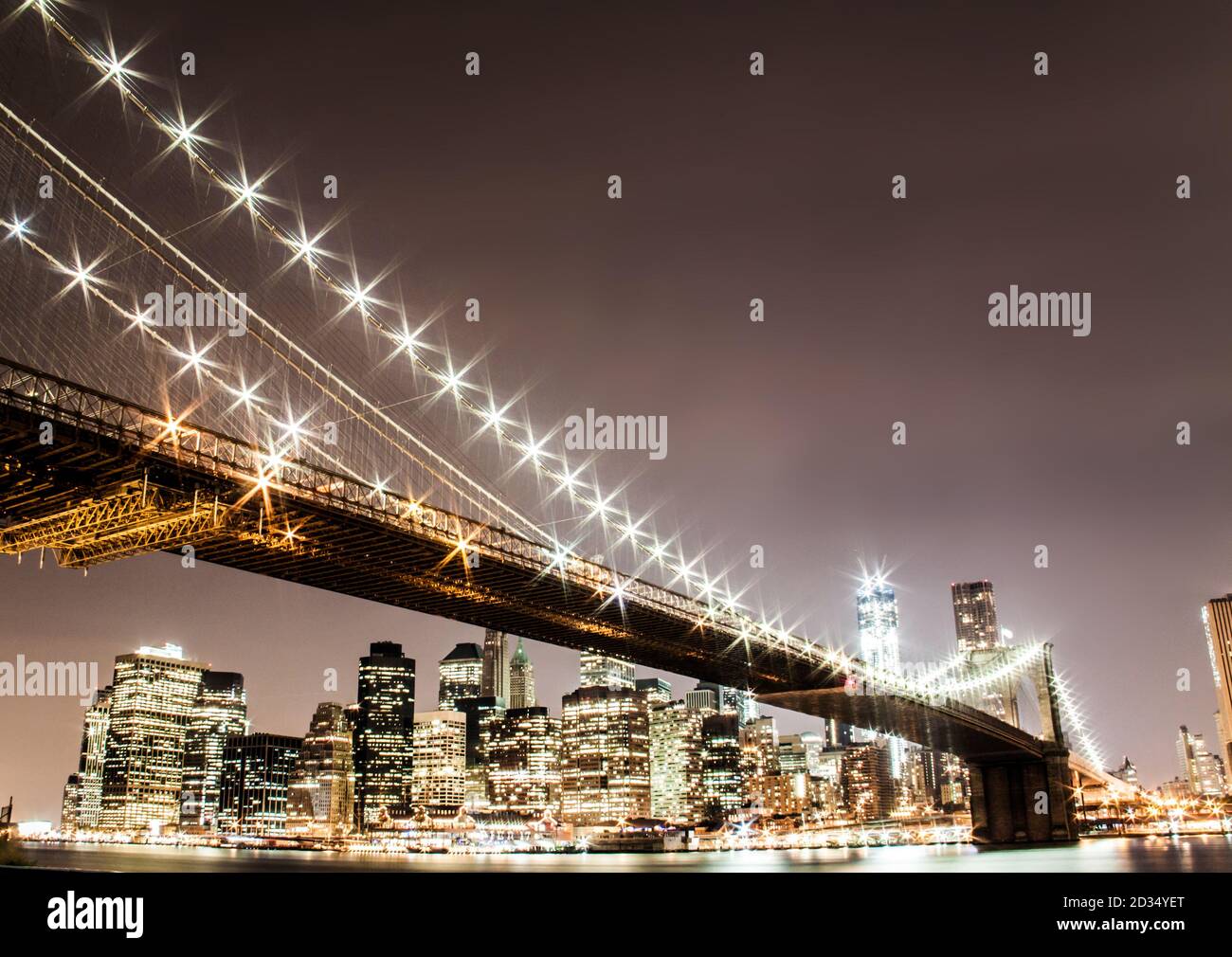 Brooklyn Bridge at night and Times Square IN NYC Stock Photo Alamy