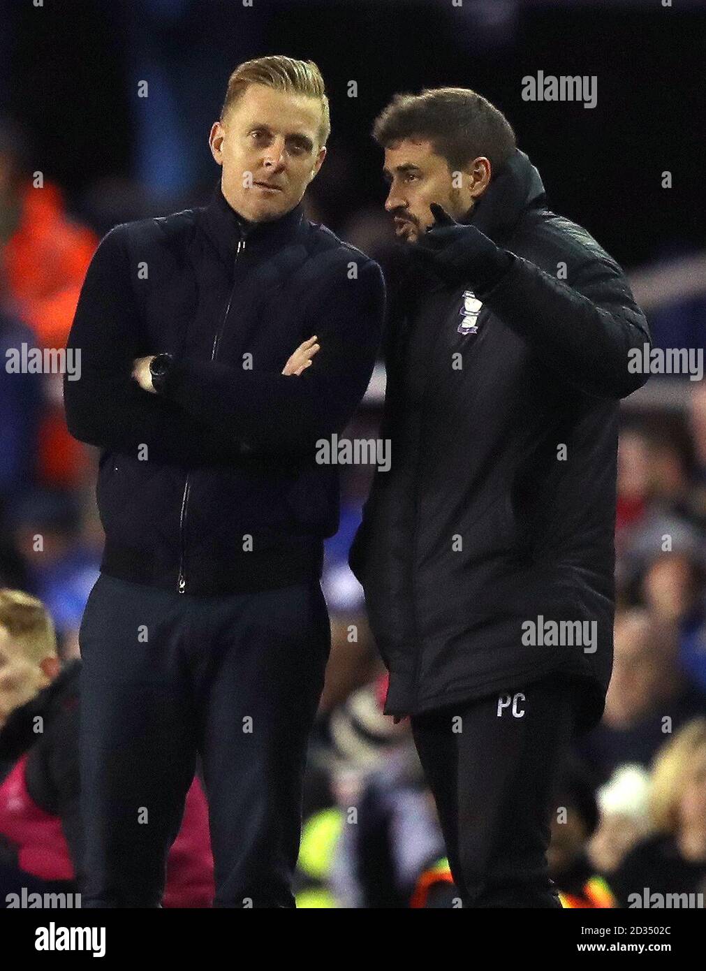 Birmingham City manager Garry Monk (left) and assistant manager Pep Clotet watch match action from the touchline during the Sky Bet Championship match at St Andrew's Trillion Trophy Stadium, Birmingham. Stock Photo
