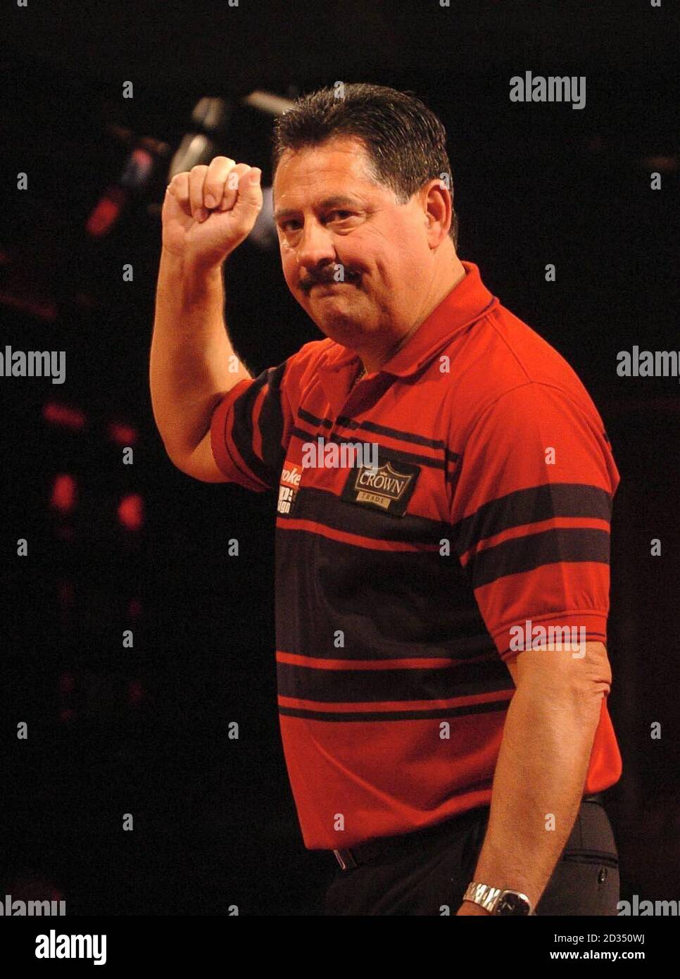 Dennis Priestley celebrates his win over Josephus Schenk in the first round during the PDC Ladbrokes.com World Championships at Purfleet, Essex. Stock Photo