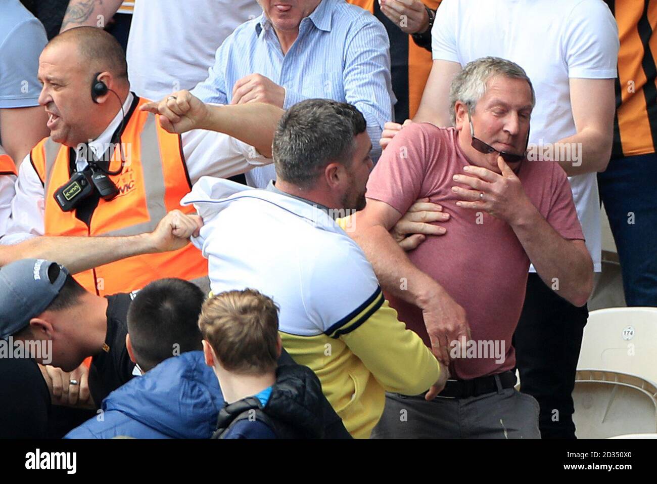 A fight breaks out among fans during the Sky Bet Championship match at The KCOM Stadium, Hull. Stock Photo