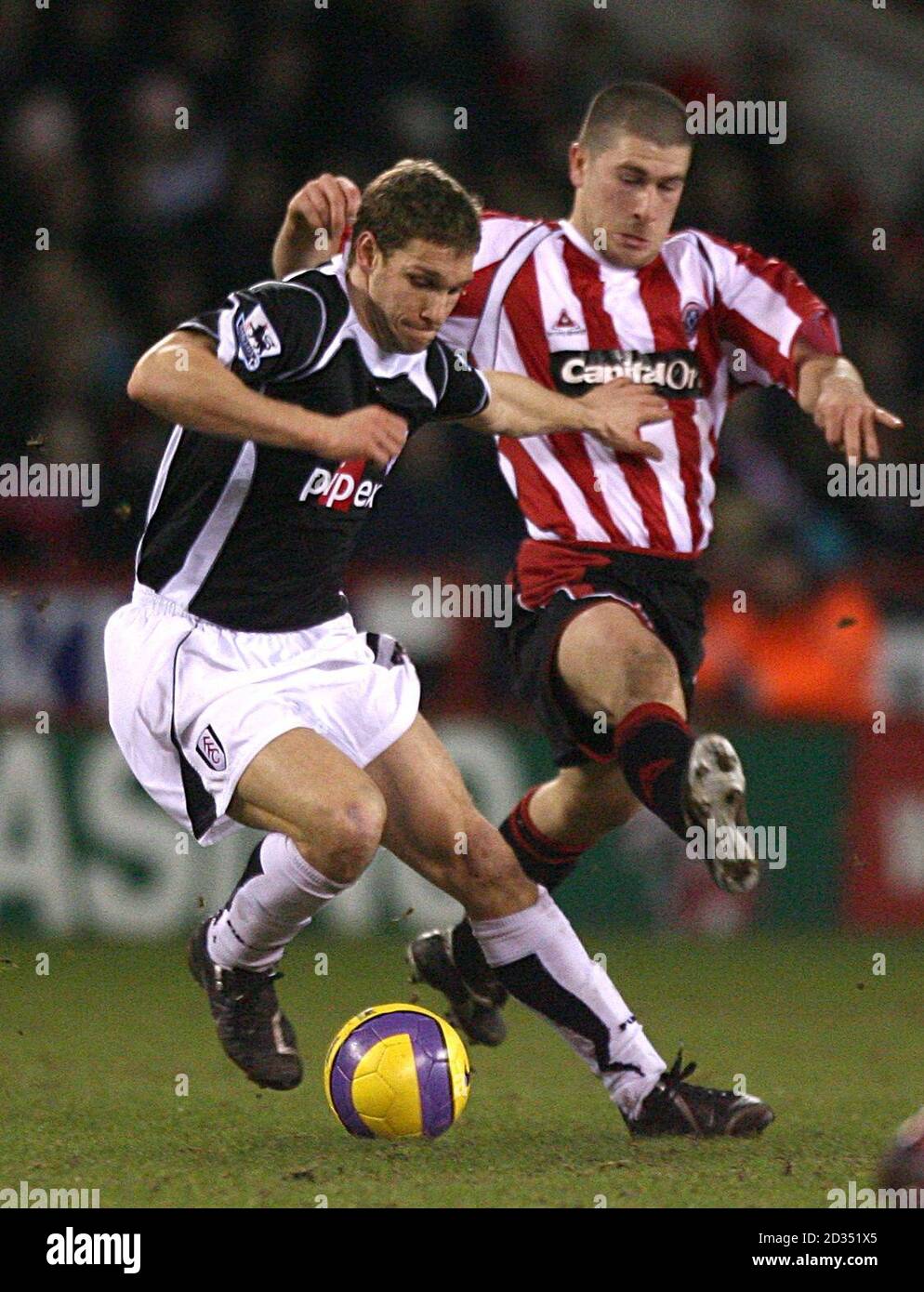 Sheffield United's Nick Montgomery (r) and Fulham's Moritz Volz (l) battle for the ball Stock Photo