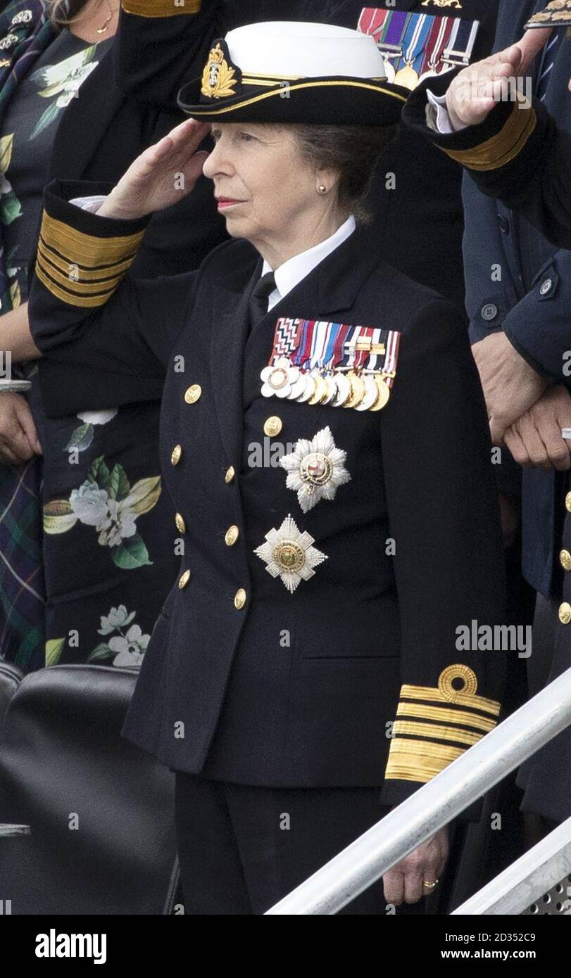 The Princess Royal takes the Royal Salute in front of serving Royal Navy submariners, veterans, families and support workers gather at HM Naval Base Clyde, the home of the UK Submarine Service at Faslane in Argyll and Bute, to mark 50 years of the Continuous At Sea Deterrent (CASD). Stock Photo