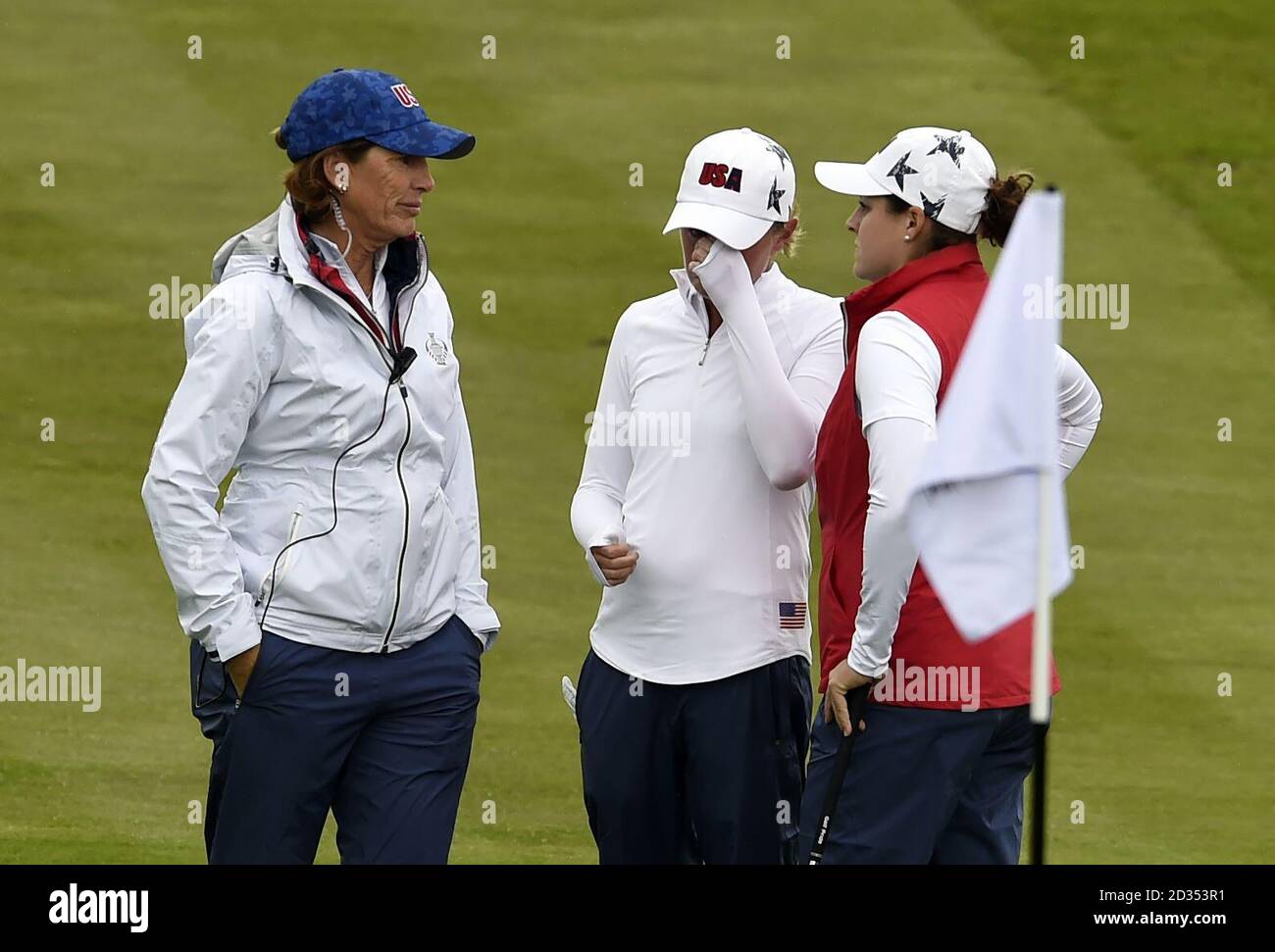 Team USA's Stacy Lewis (centre) appears emotional alongside Team USA  captain Juli Inkster (left) after playing a shot on the 14h during preview  day one of the 2019 Solheim Cup at Gleneagles