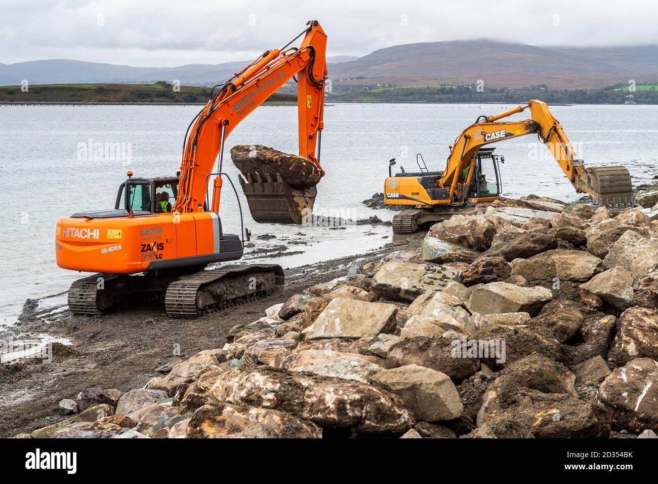 Bantry, West Cork, Ireland. 7th Oct, 2020. Cork County Council has signed off on repairs to the sea wall on the Beicin Walkway in Bantry after parts of the wall started to crumble away in the recent bad weather. Tracked diggers are placing heavy rocks on the beach in an attempt to prevent further corrosion to the popular walkway. Credit: AG News/Alamy Live News Stock Photo