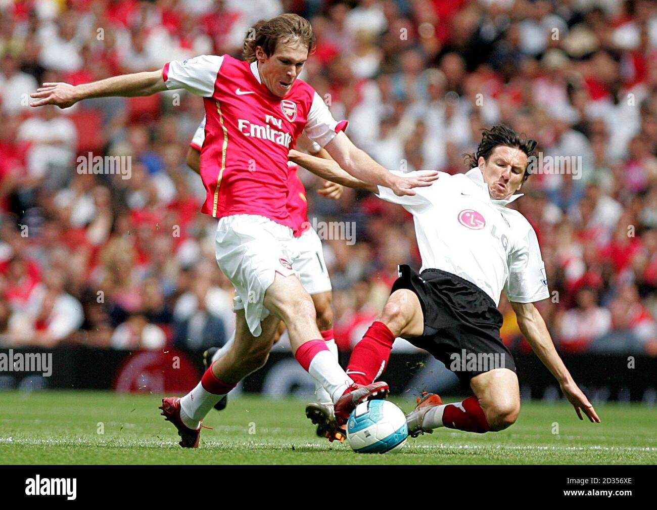 Fulham's Alexey Smertin (r) and Arsenal's Alexander Hleb (l)  battle for the ball Stock Photo