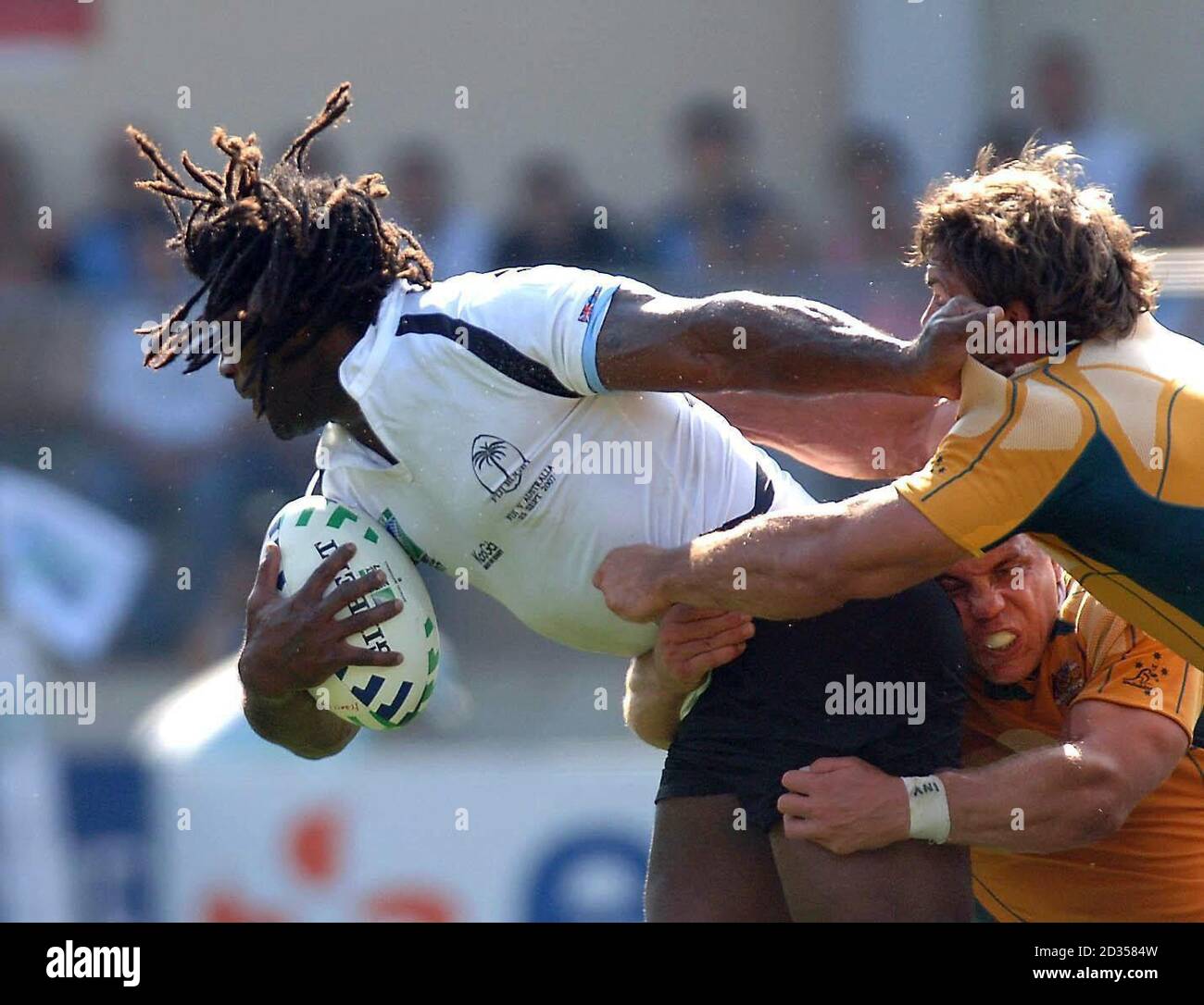 Seru Rabeni Australia's Phil Waugh holds onto Fiji's Seru Rabeni during the IRB ...