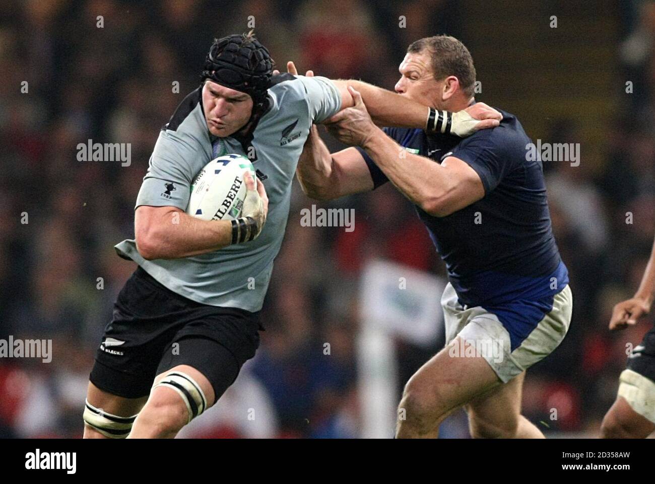 New Zealand's Ali Williams (left) and France's Pieter de Villiers battle for the ball. Stock Photo