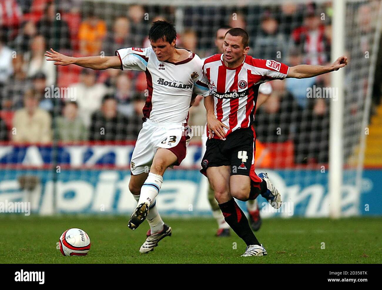 Sheffield United's Phil Bardsley (right) and Burnley's Stephen Jordan in action during the Coca-Cola Football Championship match at Bramall Lane, Sheffield. Stock Photo