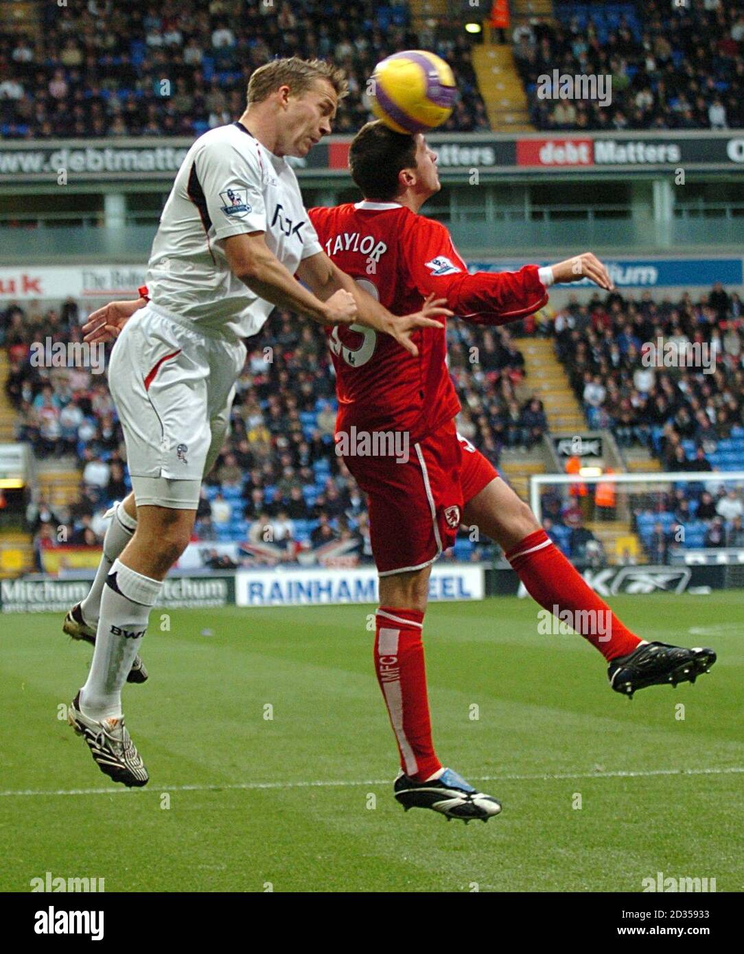 Andrew Taylor, Middlesbrough (r) and Kevin Davies, Bolton Wanderers battle for the ball Stock Photo