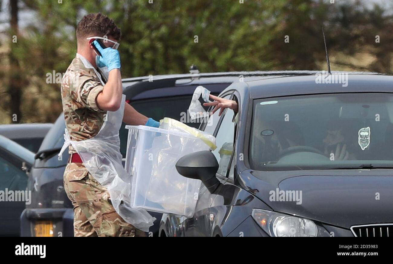 A soldier collects samples at a Covid-19 testing centre in Southport, as the UK continues in lockdown to help curb the spread of the coronavirus. Stock Photo