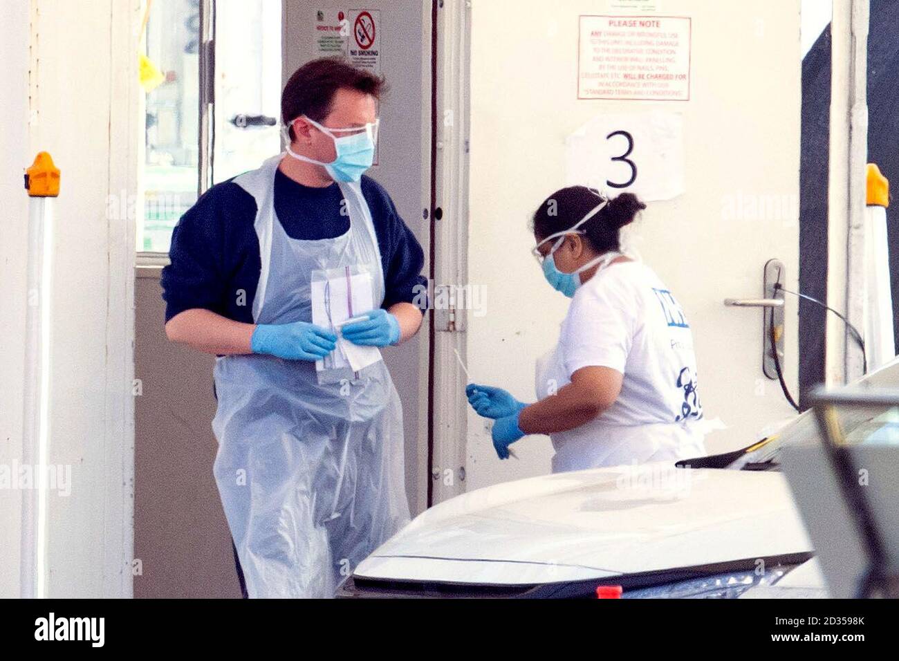 Testers wearing personal protective equipment ppe work hi-res stock ...