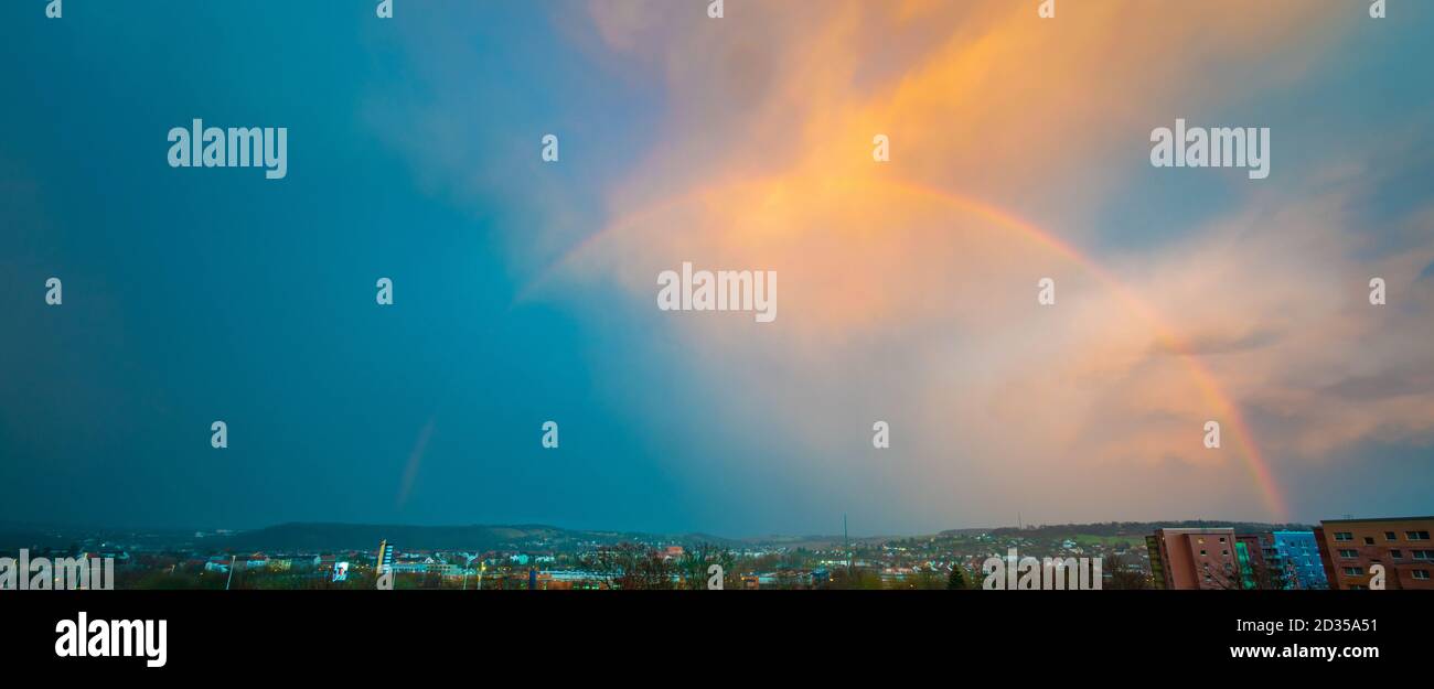 Sky panorama with rainbow after rain Stock Photo - Alamy