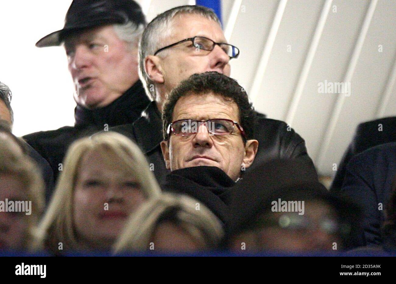 England manager Fabio Capello takes his seat for the second half Stock Photo