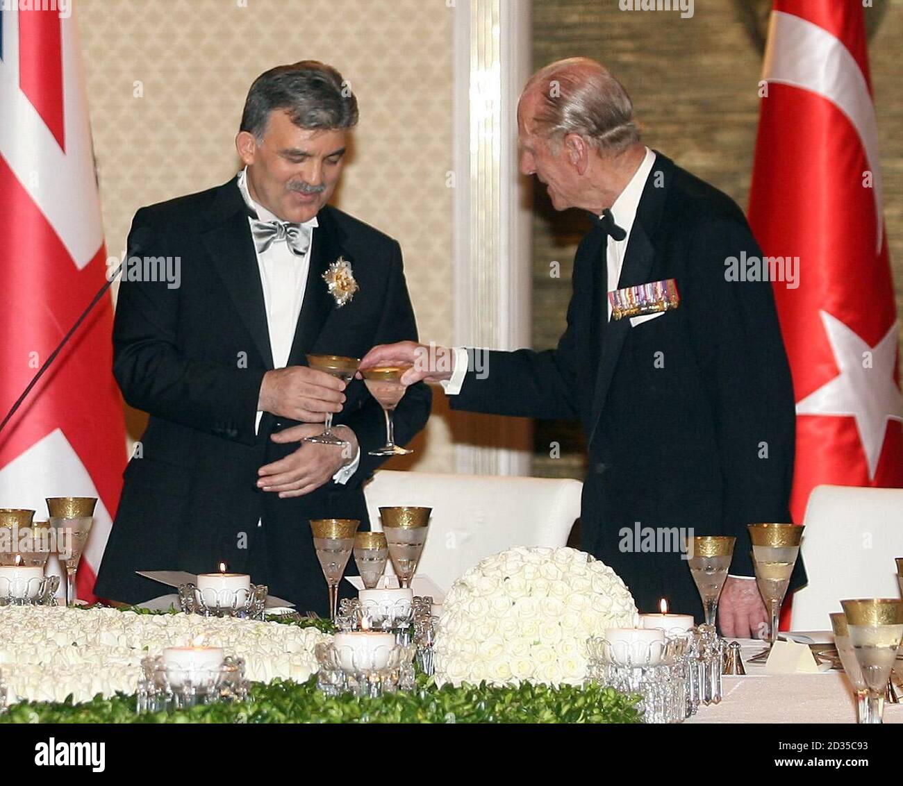 The Duke of Edinburgh shares a toast with President Abdullah Gul at the ...
