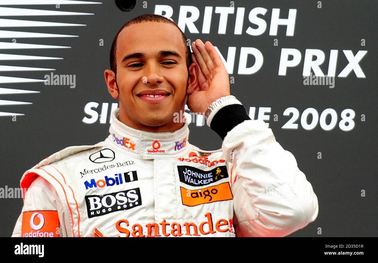 McLaren Mercedes Lewis Hamilton celebrates after winning the British