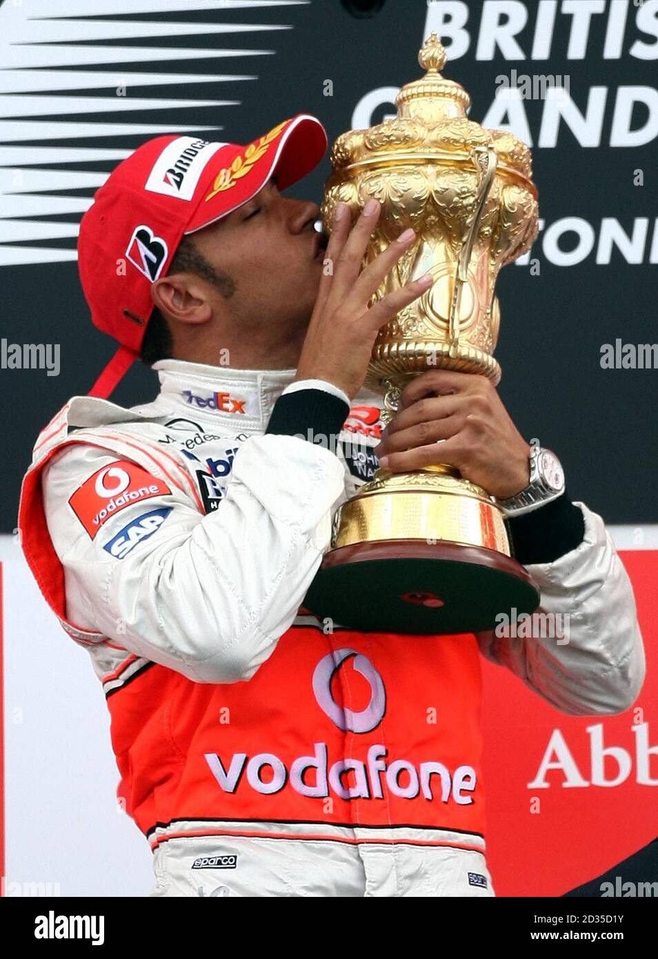 Ferrari's Kimi Raikkonen with the winners trophy on the podium after  winning the British Grand Prix at Silverstone, Northamptonshire Stock Photo  - Alamy