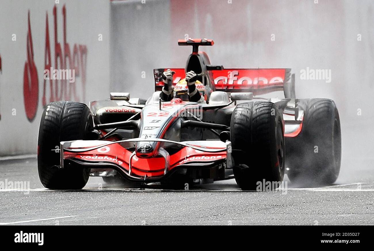 McLaren's Lewis Hamilton celebrates winning the British Grand Prix at ...