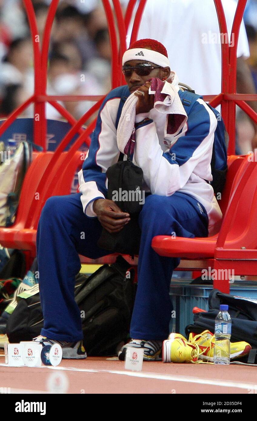 Great Britain's Phillips Idowu sits out the rest of the qualifying competition after succeeding with his first jump, in the Men's Triple Jump at the National Stadium, Beijing during the 2008 Beijing Olympic Games. Stock Photo