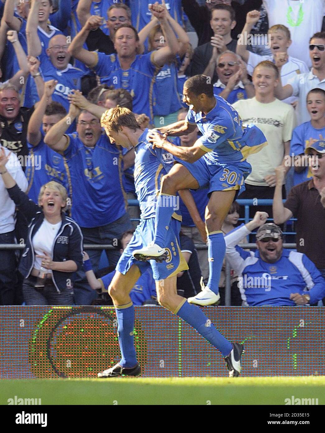Portsmouth's Peter Crouch (left) celebrates scoring their second goal with Armand Traore. Stock Photo
