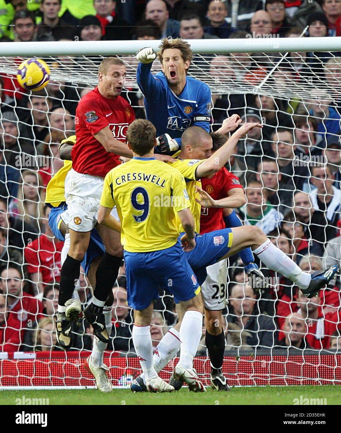 Manchester United goalkeeper Edwin Van der Sar jumps highest to punch