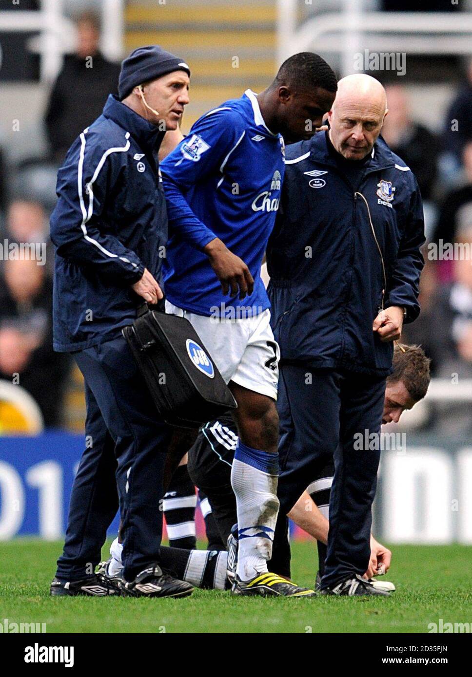 Everton's Victor Anichebe (centre) is helped off the field Stock Photo