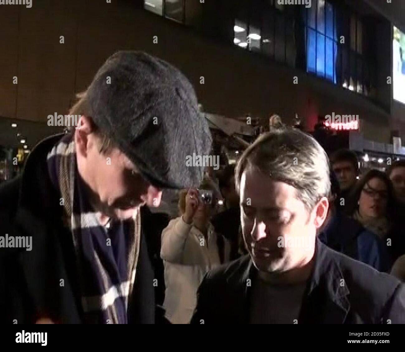 Video image taken from PATV of Liam Neeson (left), whose wife Natasha Richardson died after a skiing accident, taking with Matthew Broderick during a visit to New York's Broadway where in a symbolic tribute to the stage and screen star, illuminations in the city's theatre district were lowered for one minute at 8pm local time. Stock Photo