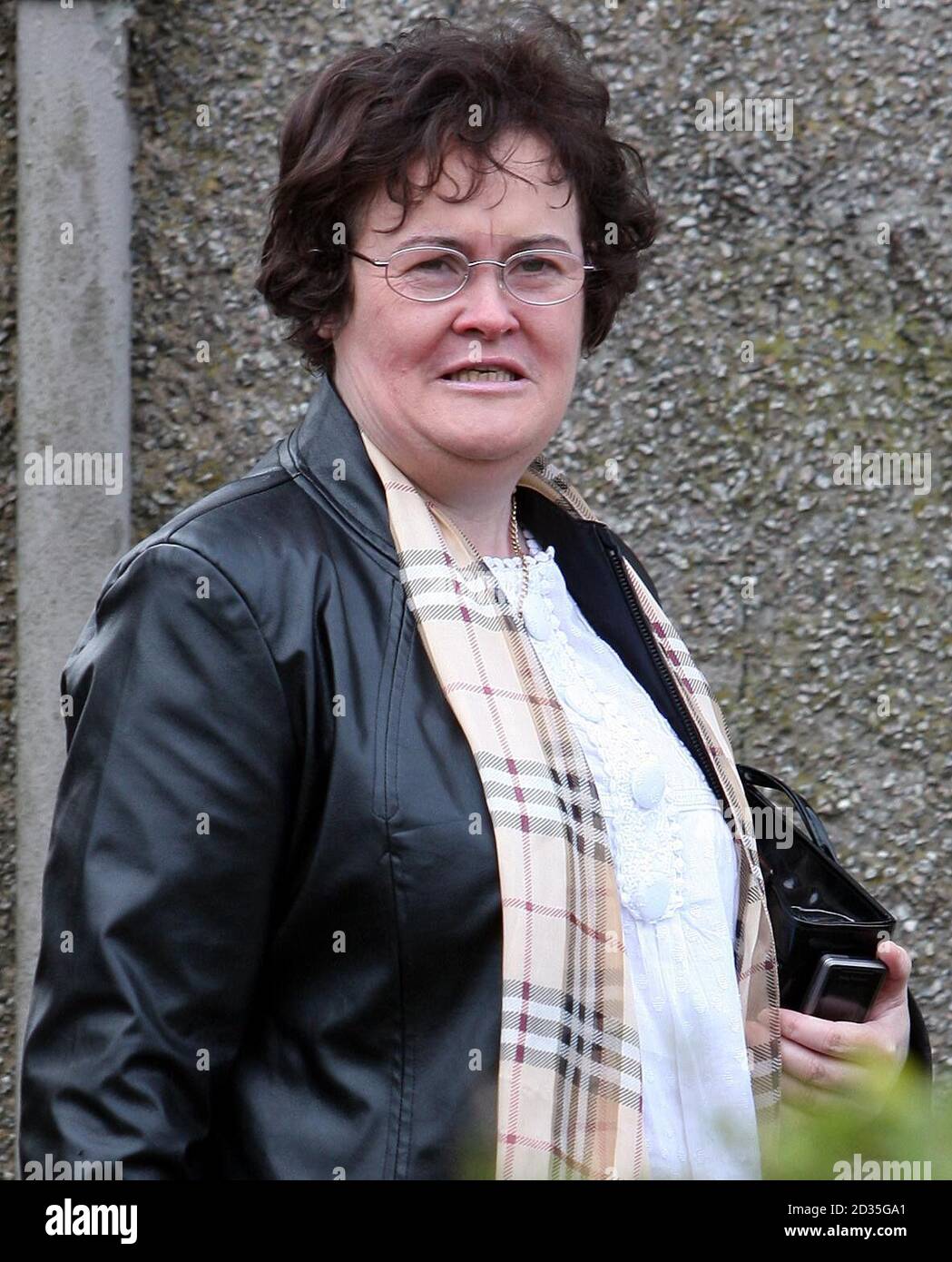 Britain's Got Talent star Susan Boyle, sporting a new look after undergoing a makeover, outside her home in Blackburn, West Lothian. Stock Photo