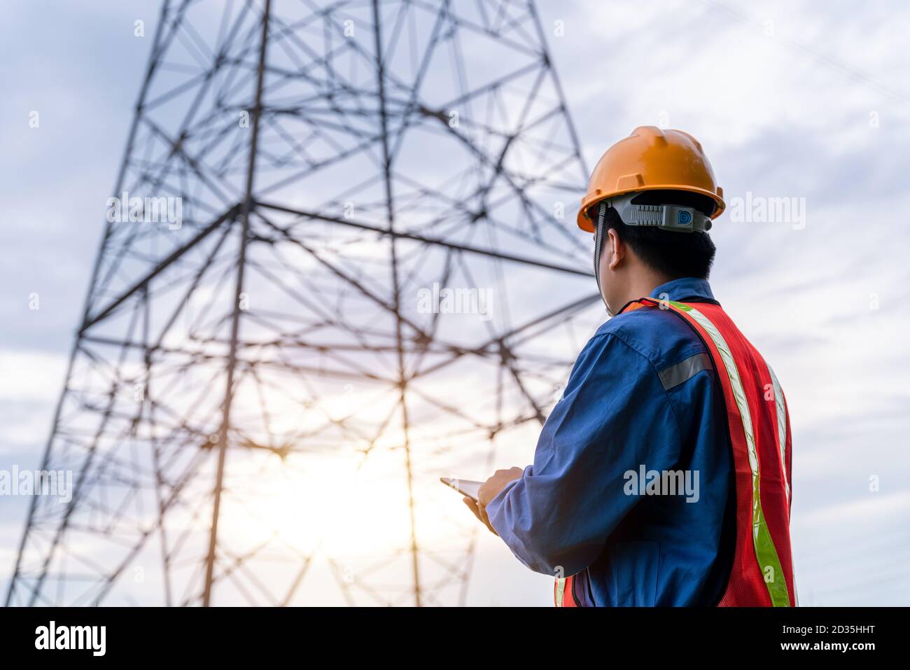 Electrical engineer wear safety clothes standing and watching at the