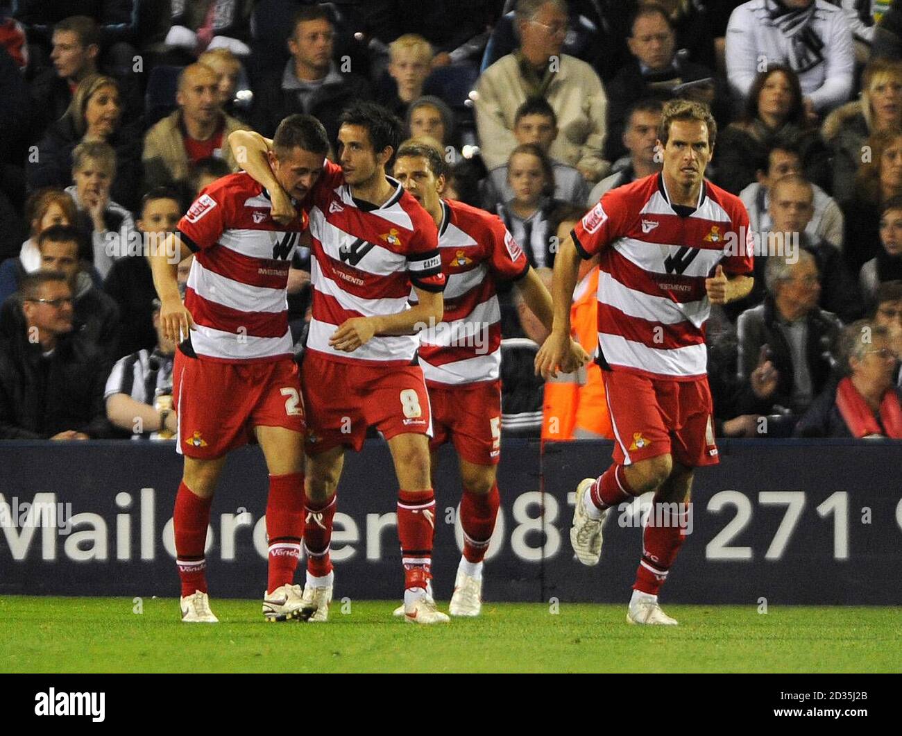 Doncaster Rovers' Waide Fairhurst (left) is congratulated by his team mates after scoring the opening goal of the game during a Coca-Cola Championship match at The Hawthorns, West Bromwich. Stock Photo