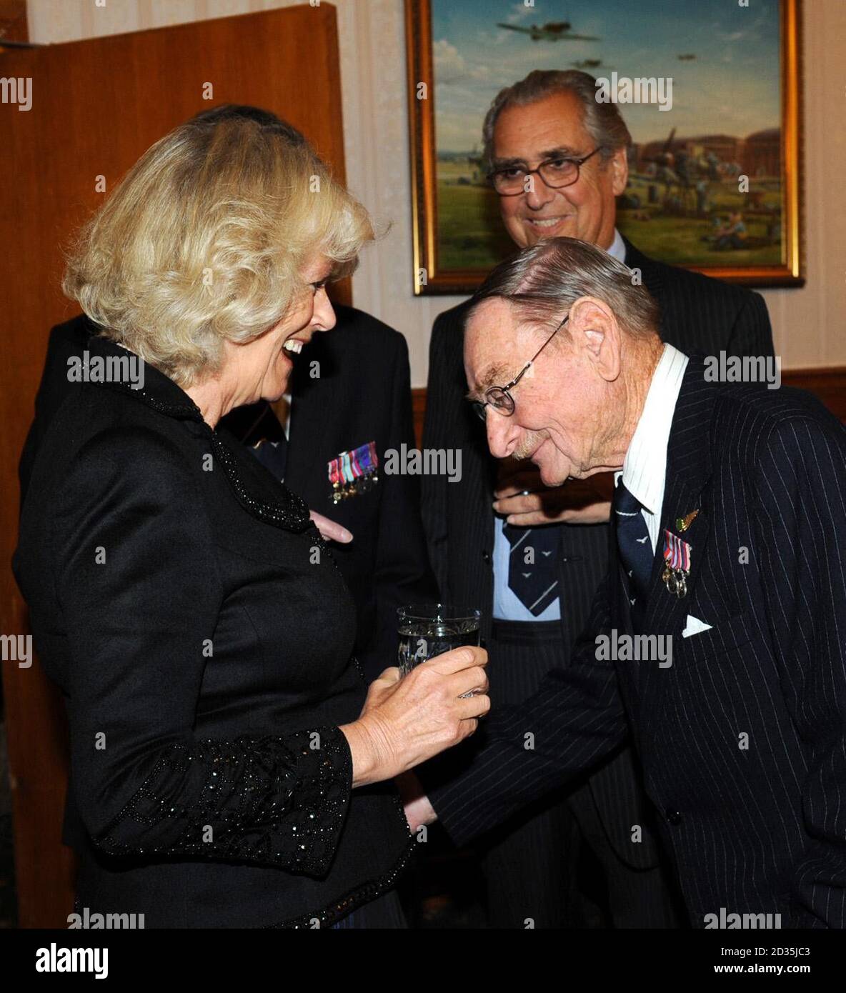 The Duchess of Cornwall speaks with RAF Ex-Prisoners of War (names not known) at RAF Henlow, Bedfordshire where she attended an RAF Ex- Prisoners of War Association dinner. Stock Photo