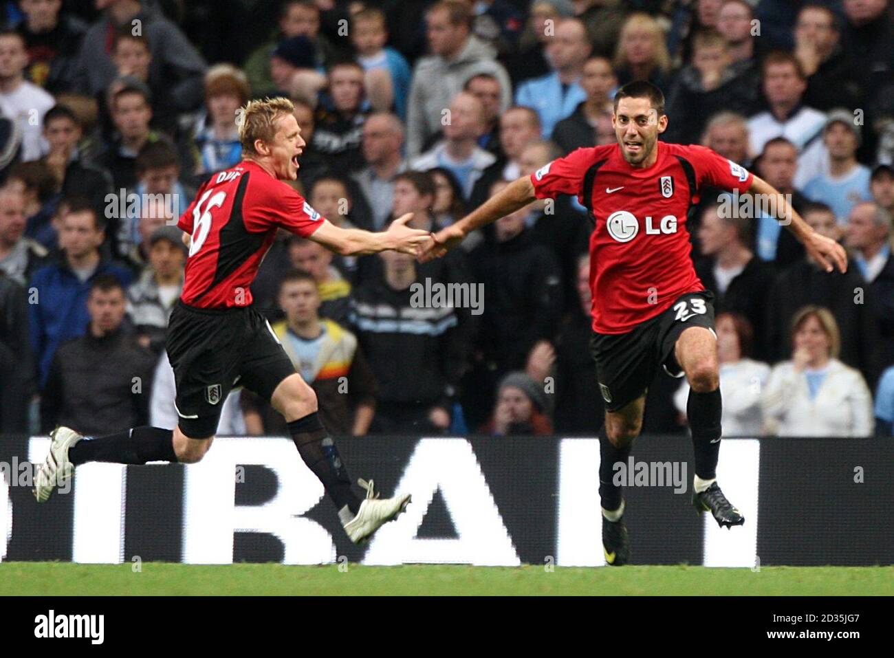 Fulham's Clint Dempsey (right) celebrates with team mate Damien Duff after scoring his side's second goal of the game Stock Photo